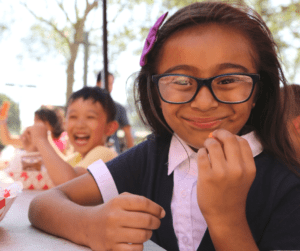 young woman enjoying Los Angeles Food Bank food