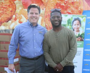 LaDainian Tomlinson with Food Bank CEO Michael Flood