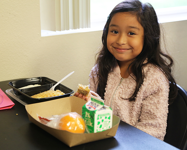 Young girl at lunch