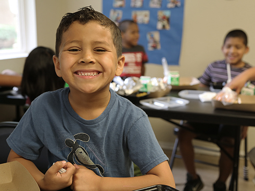 Young boy at Summer Lunch Program.