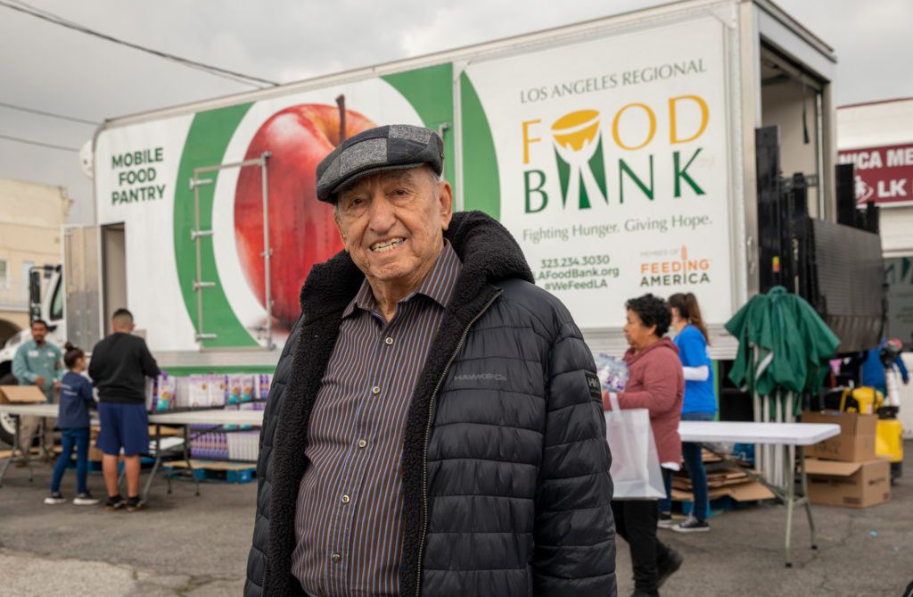 older man in front of Food Bank truck