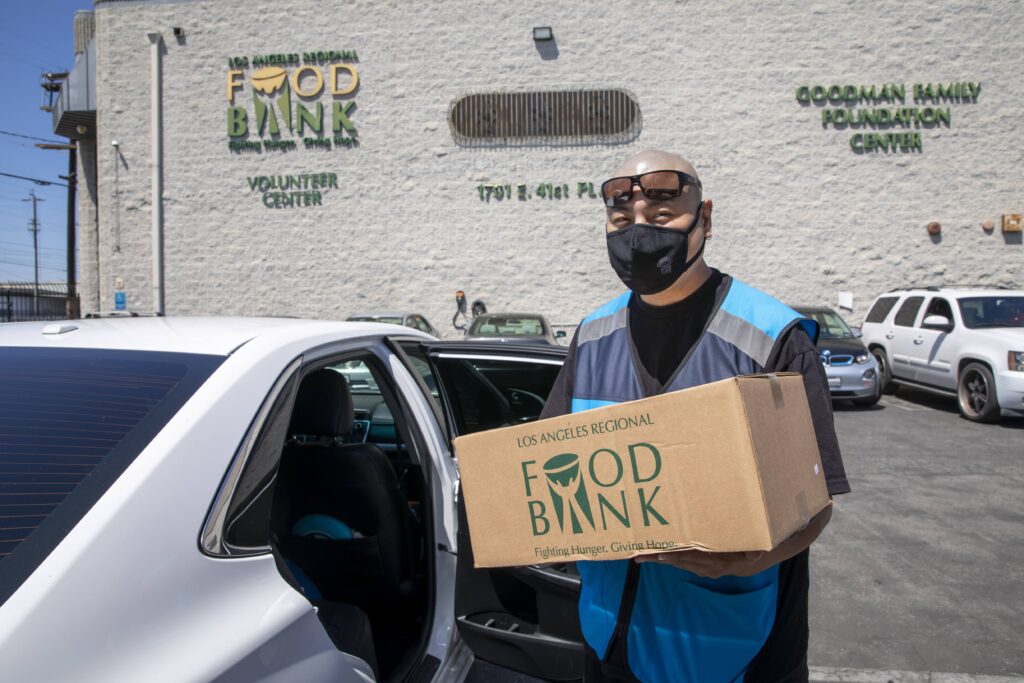Amazon driver with LA Regional Food Bank Box