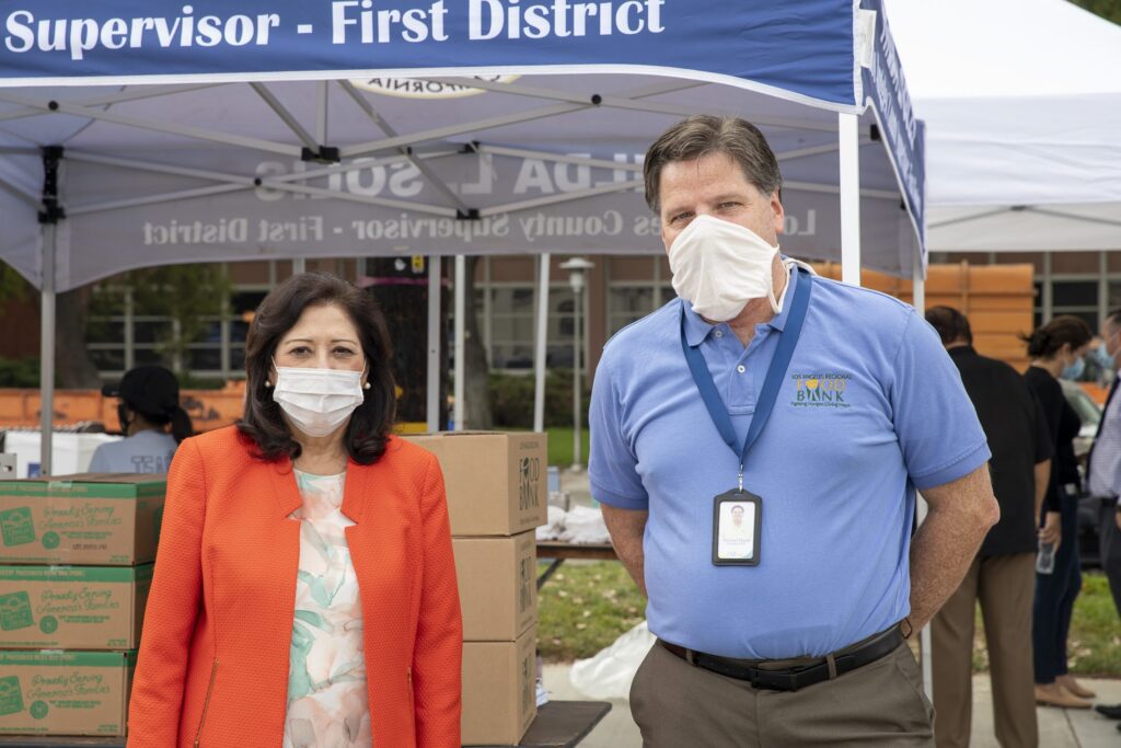 LA County Supervisor Hilda Solis and LA Food Bank President and CEO Michael Flood