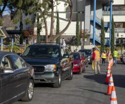 Cars line up for a drive through distribution by the LA Regional Food Bank