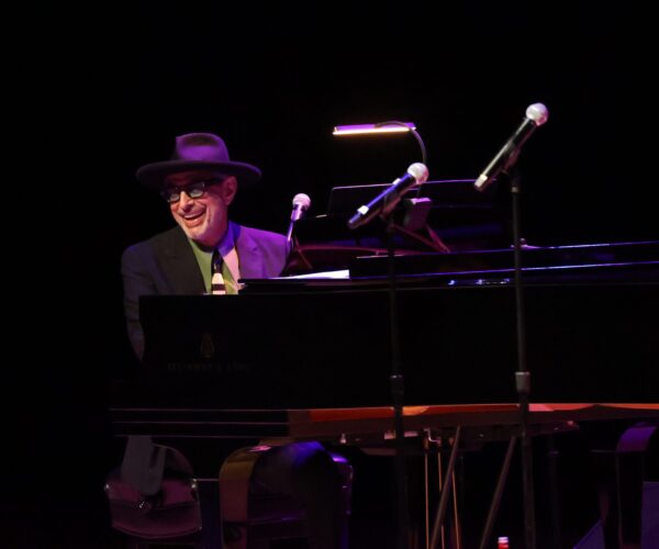 Jeff Goldblum sitting at a piano