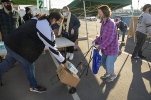 Food recipients receive food at a distribution hosted in partnership with the LA Regional Food Bank.