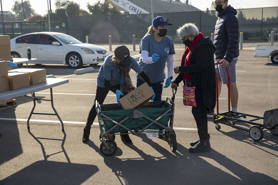 Food recipients receive food at a distribution hosted in partnership with the LA Regional Food Bank.
