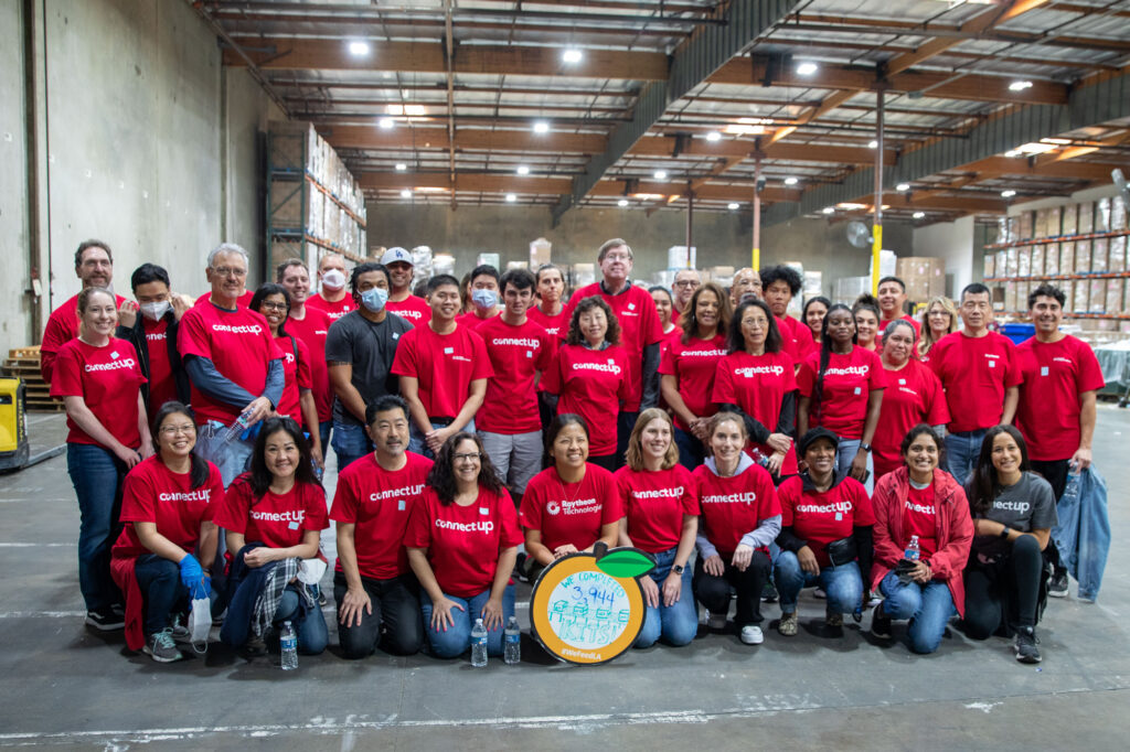 Raytheon employees at the Commerce warehouse after volunteering