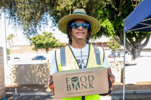 Volunteer holds Food Bank box