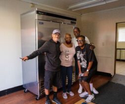 Bryant Temple staff with their new refrigerator