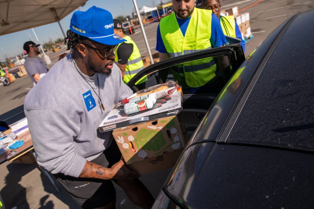 Tremayne Anchrum Jr at a Rams distribution at SoFi Stadium