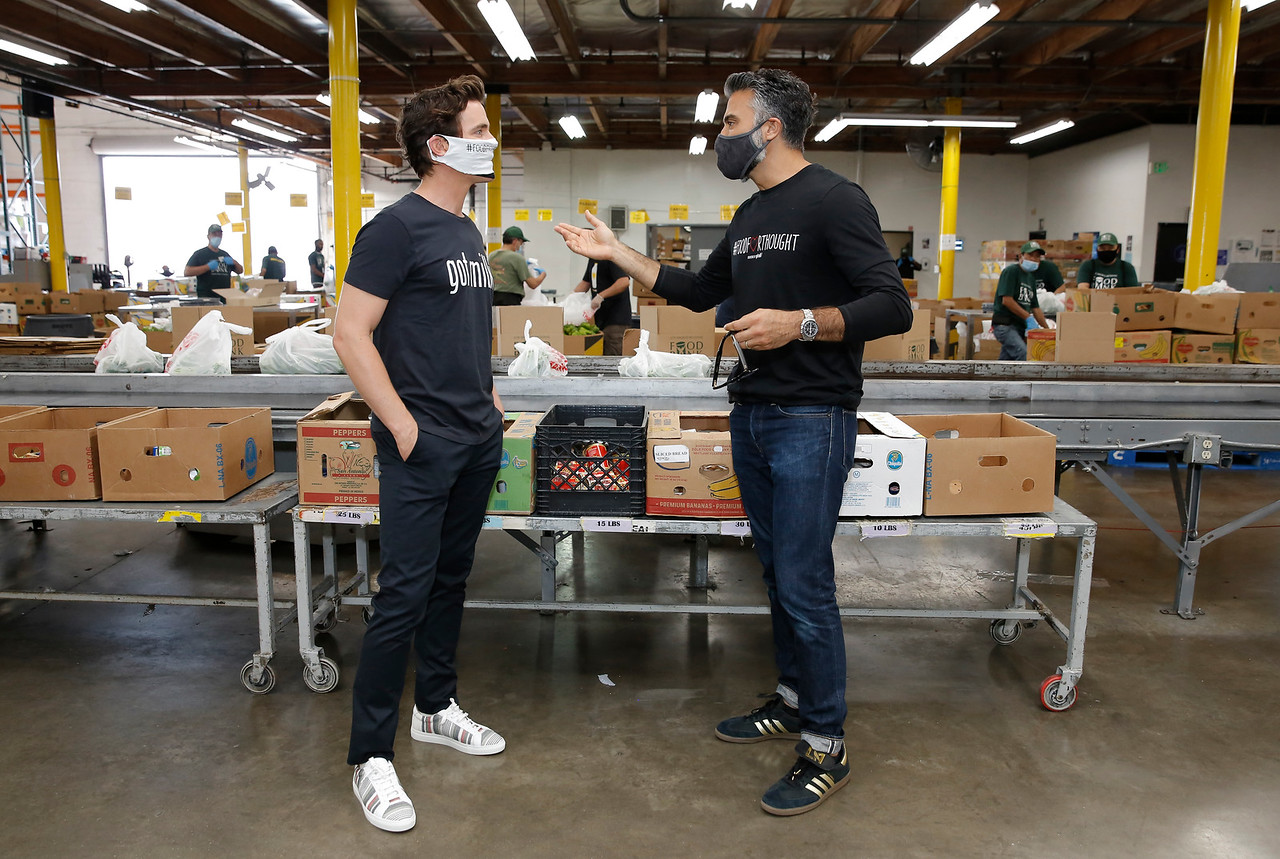 Matt Bommer and Jaime Camil at the Los Angeles Regional Food Bank