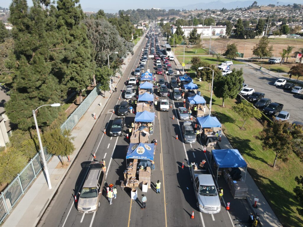 An aerial view of a Los Angeles Regional Food Bank drive through food distribution for those in need of food assistance.