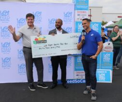 Enterprise presents a check to LA Regional Food Bank President and CEO on ABC7 during Feed SoCal.