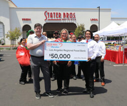 Stater Bros Market presents the LA Regional Food Bank President and CEO with a check during Feed SoCal.
