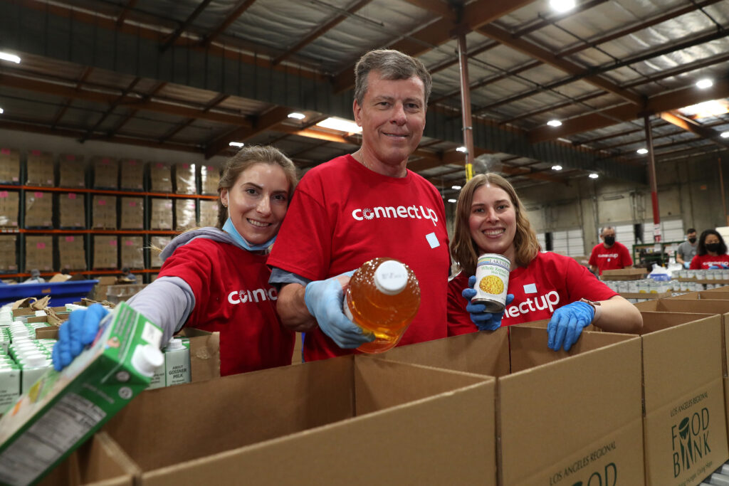 Raytheon, an RTX Business, hosts a volunteer day at the LA Regional Food Bank with its staff