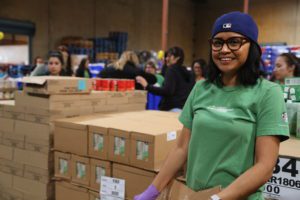 Starbucks partner packaging food at the Los Angeles Regional Food Bank