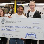 Robert Trujillo and All Within My Hands Foundation presents the Los Angeles Regional Food Bank with a check for $5,000. Robert Trujillo presents the Los Angeles Regional Food Bank with a check for $5,000.