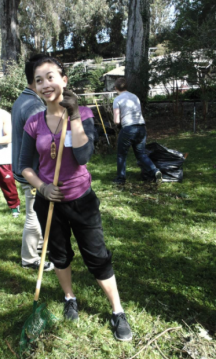 The San Francisco Zoo often invites the community to help Renew the Zoo, where Rachel and others come together and help beautify or spruce up the landscape. A volunteer holding a rake at a volunteer event at the San Francisco Zoo to help beautify the space.