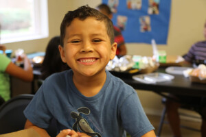 young student smiles at camera