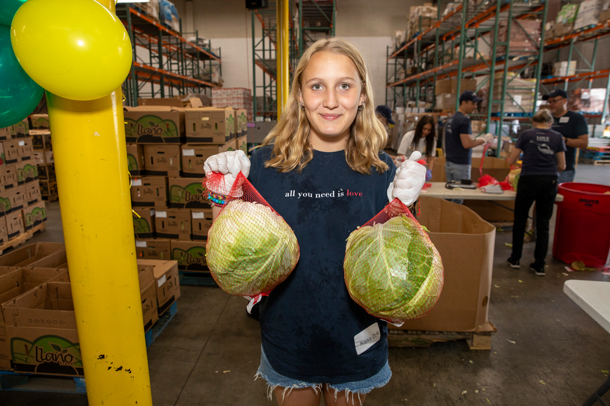 Volunteer holding produce