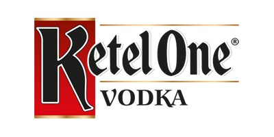 The logo of Ketel One showcases bold, stylized black lettering outlined in white, set against a striking red and gold backdrop. This iconic design resonates with the same vibrant energy found at the Los Angeles Regional Food Bank events.