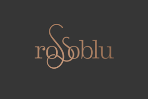 The elegant logo features the name "Rossoblu" in stylish, intertwined bronze letters on a dark background, reflecting its partnership with the Los Angeles Regional Food Bank.