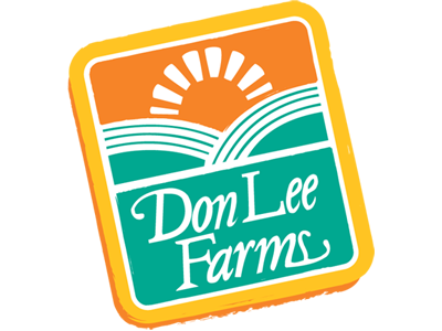 The logo of Don Lee Farms, featured prominently at the Los Angeles Regional Food Bank, showcases a stylized sun rising over fields in orange and green. The name "Don Lee Farms" is elegantly scripted in white cursive text against a solid yellow background.