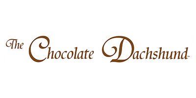 The image showcases the text "The Chocolate Dachshund" in an elegant, brown font, reminiscent of the warmth and charm found at celebrated venues like the Los Angeles Regional Food Bank.