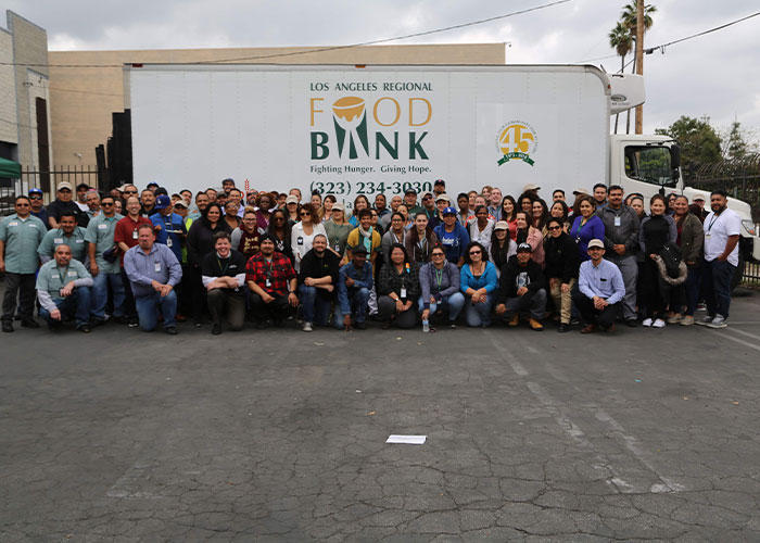 Food Bank Staff photo outside of food bank before pandemic