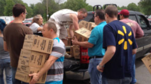 Walmart volunteers helping distribute food